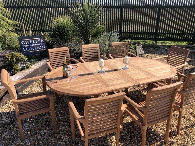 Teak extending table with 8 stacking chairs